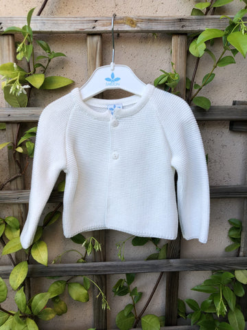Chaqueta unisex de algodón 100% con manga larga en punto bobo color blanco roto y abrochada delante con dos botones