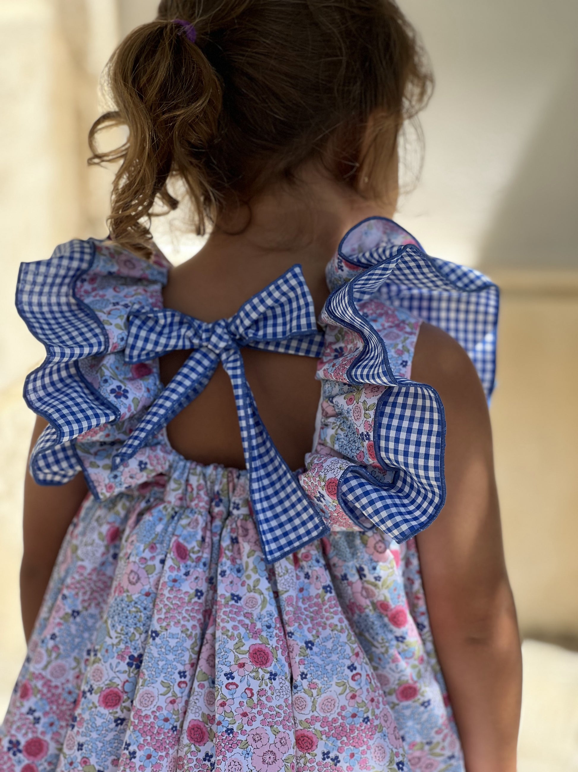 Espalda jesusito floral bebé niña con lazo vichy azul