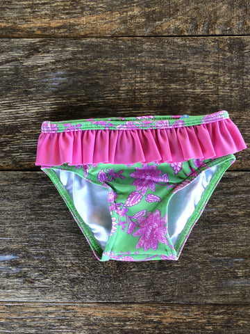 culetin para niña con flore fuxia sobre fondo verde de la coleccion ciclamen