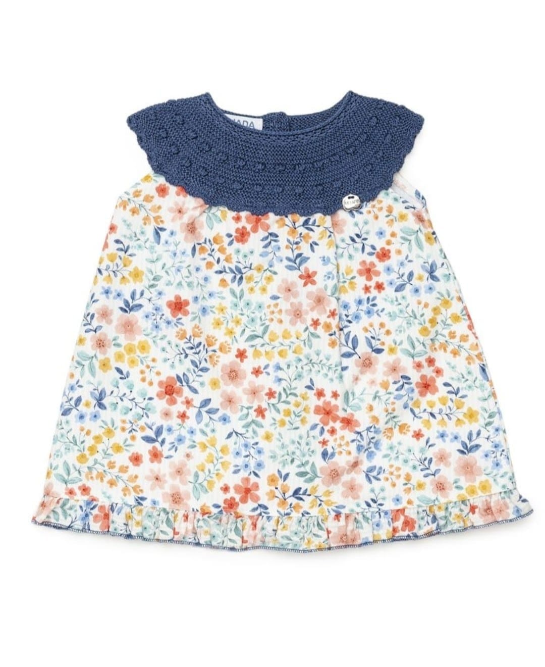 vestido cuerpo redondo de hilo color azul noche con bodoques y cuerpo de flores de Juliana